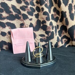 Gold Ring on Black Display Stand